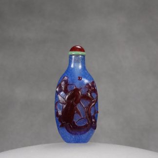 G23 A red overlay blue glass "Year after Year" snuff bottle