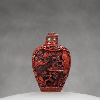 O5 A carved cinnabar lacquer “Village at lake” snuff bottle